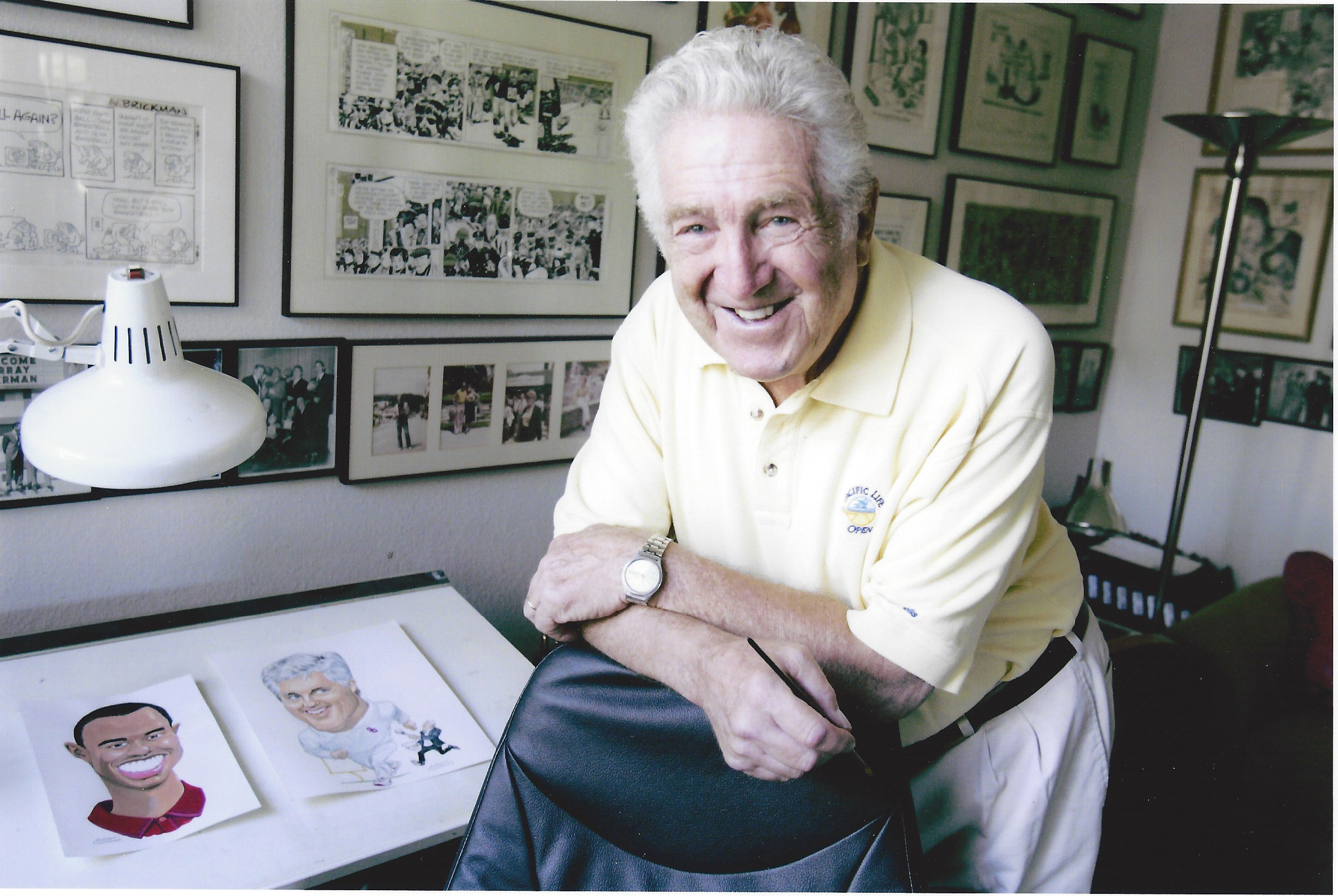 Murray Olderman with some of his cartoons.