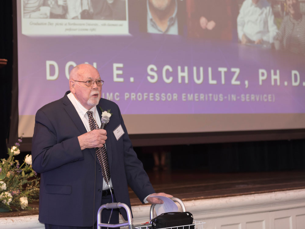 Don E. Schultz speaking at an event.