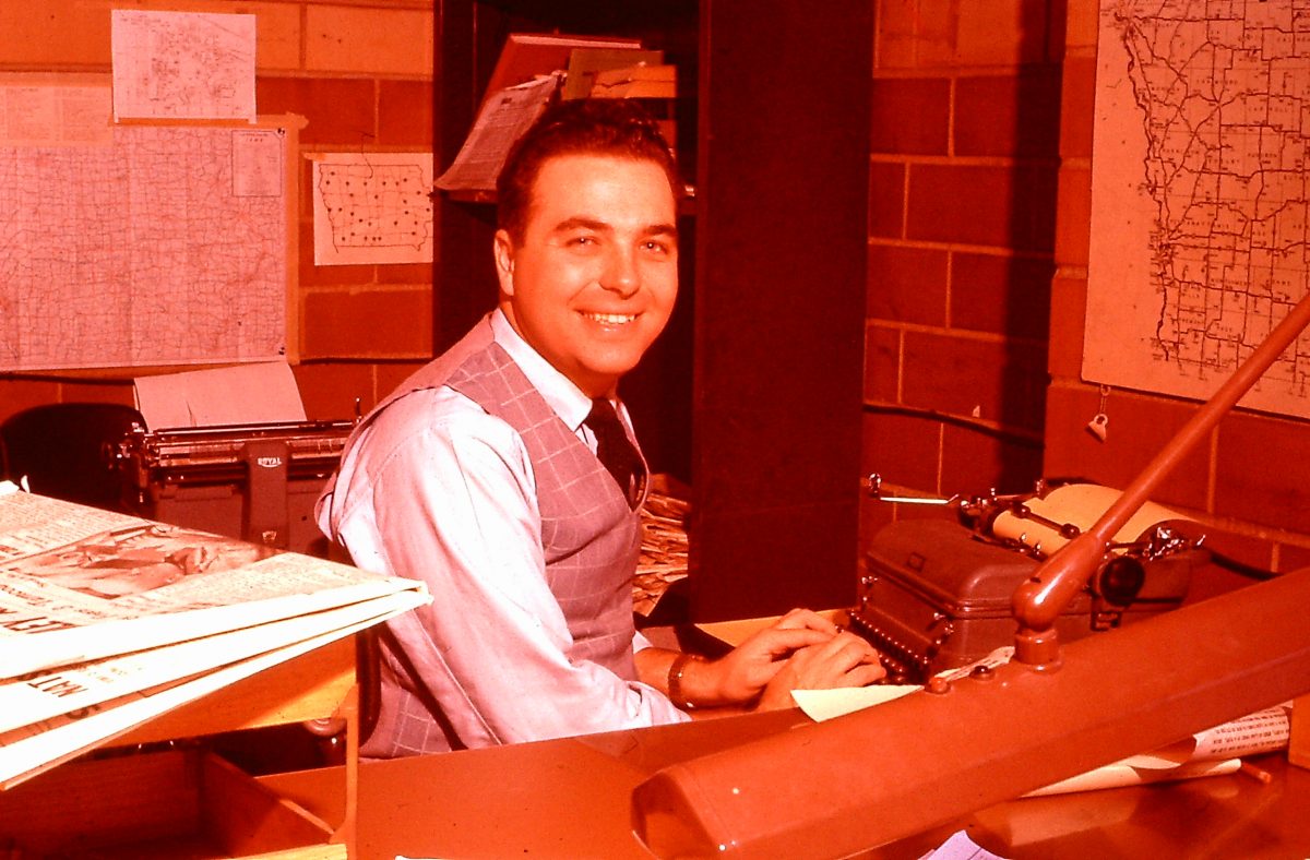 Ray Nelson at typewriter at Medill.