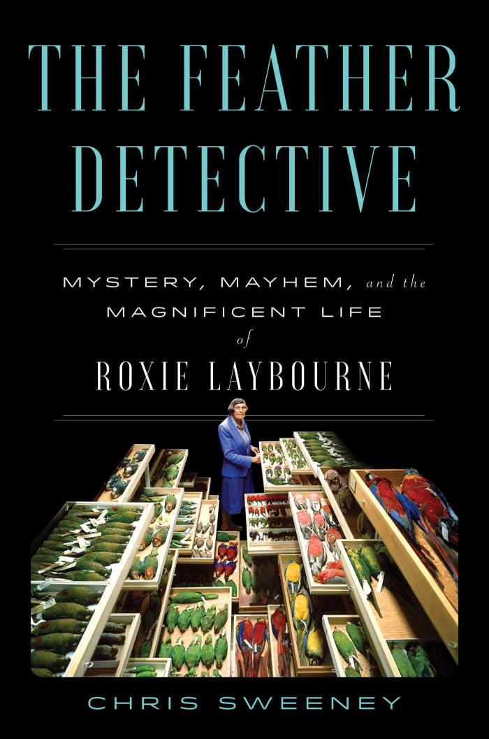 Photo of Roxie with forensic bird evidence in boxes