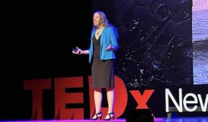 Alice Foeller standing on Ted Talk stage