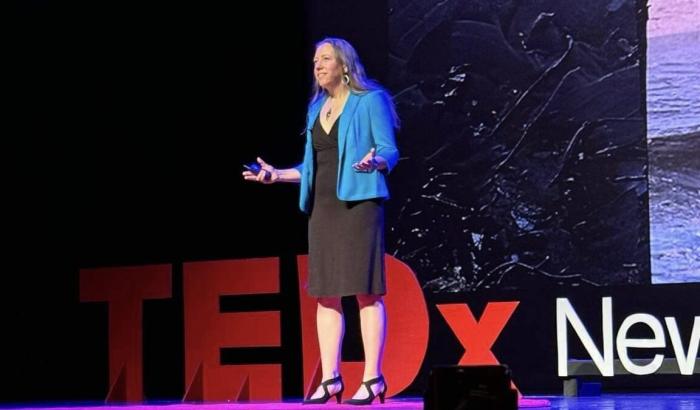 Alice Foeller standing on Ted Talk stage